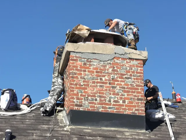 Middleburg Heights Chimney Sweep installing a custom chimney crown in Middleburg Heights, OH