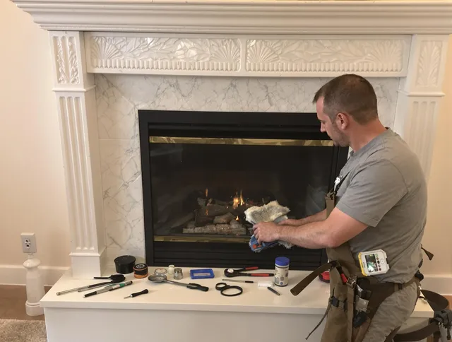 Middleburg Heights Chimney Sweep performing fireplace maintenance in Middleburg Heights, OH